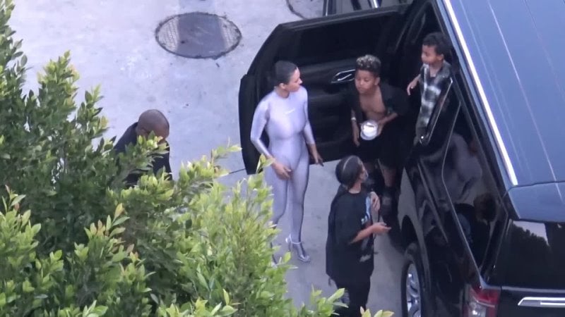 Kanye wests wife bianca censori dons shiny bodysuit for easter family outing (1080p)