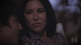 Brunette woman watching porn with her boyfriend in bed
