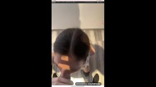 Young brunette in floral top performing solo masturbation